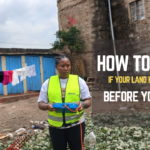 Hydrogeologist conducting a resistivity survey on land in Kenya before borehole drilling