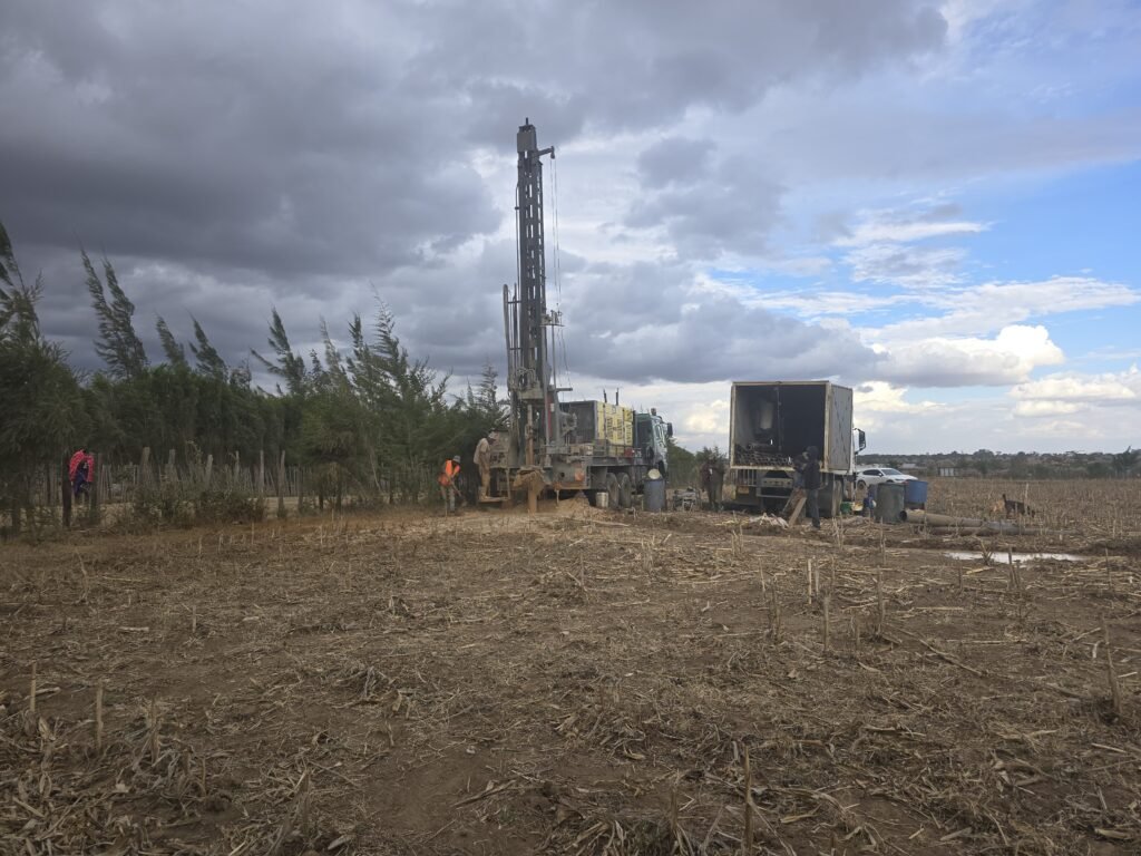 Bonvic Drilling rig and crew on a borehole site in Kenya